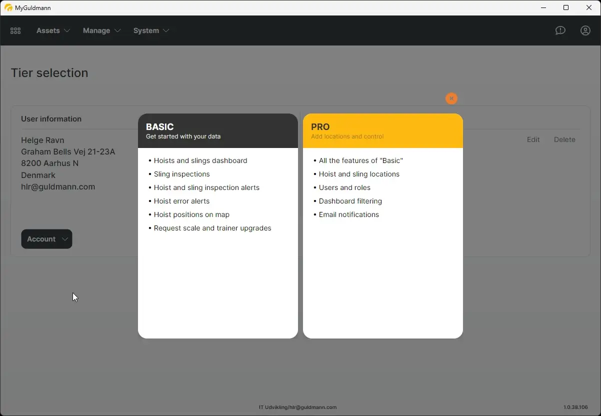 The screenshot displays the tier selection screen within the MyGuldmann application, showcasing the features available in the Basic and Pro tiers.